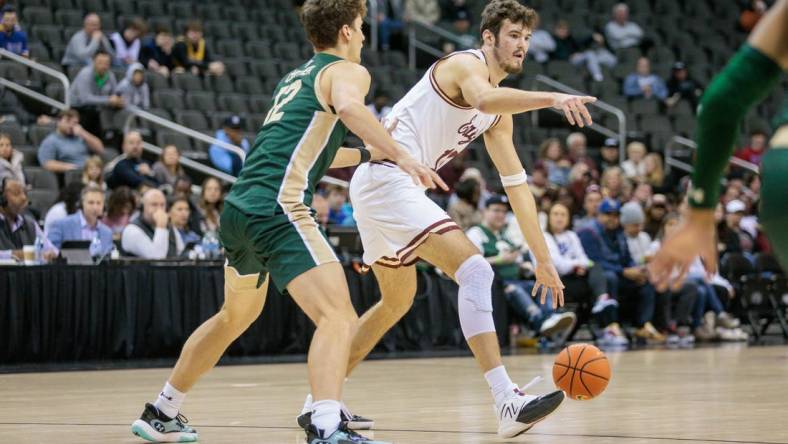 Nov 22, 2023; Kansas City, Missouri, USA; Boston College Eagles forward Quinten Post (12) looks to set the play during the first half against the Colorado State Rams at T-Mobile Center. Mandatory Credit: William Purnell-USA TODAY Sports