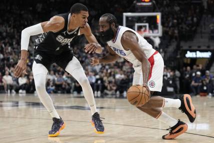 Nov 22, 2023; San Antonio, Texas, USA; Los Angeles Clippers guard James Harden (1) drives to the basket against San Antonio Spurs forward Victor Wembanyama (1) during the first half at Frost Bank Center. Mandatory Credit: Scott Wachter-USA TODAY Sports