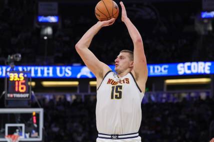 Nov 22, 2023; Orlando, Florida, USA; Denver Nuggets center Nikola Jokic (15) shoots the ball during the second quarter against the Orlando Magic at Amway Center. Mandatory Credit: Mike Watters-USA TODAY Sports