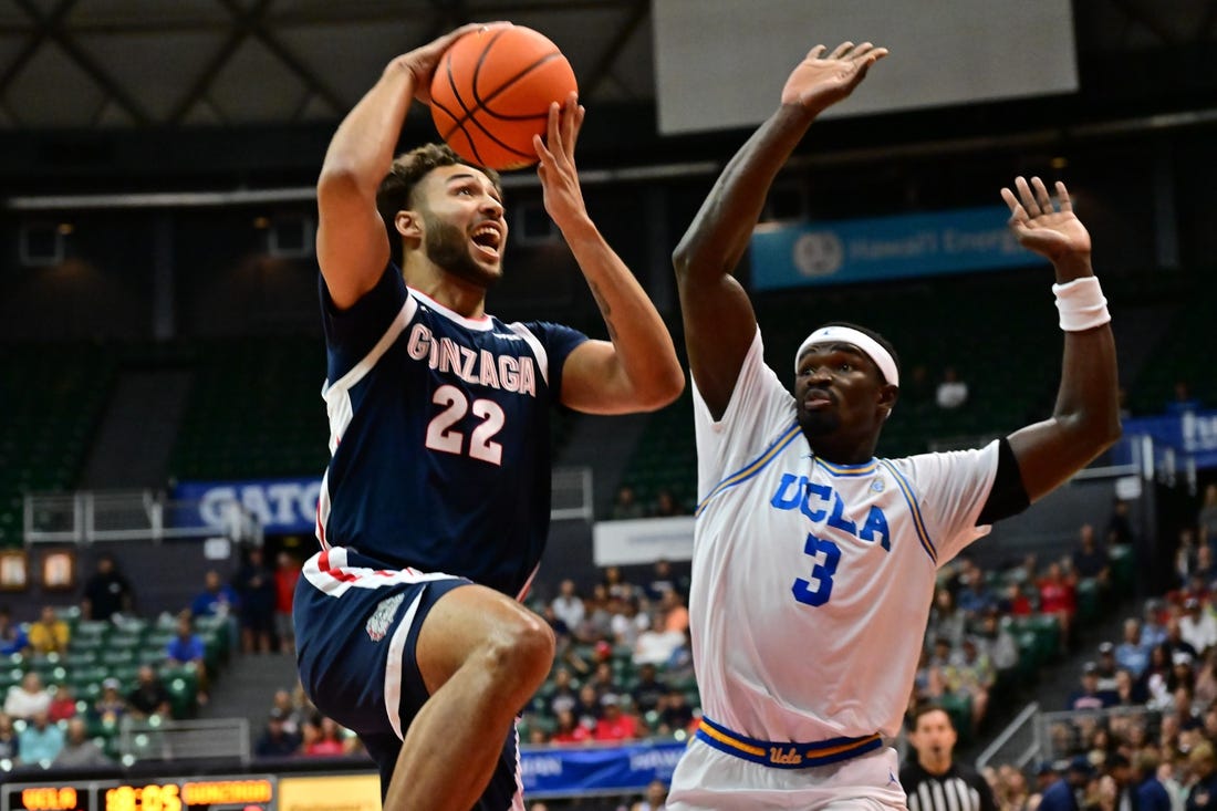 Nov 22, 2023; Honolulu, HI, USA; sGonzaga Bulldogs forward Anton Watson (22) shoots the ball defended by UCLA Bruins forward Adem Bona (3) during the first period at SimpliFi Arena at Stan Sheriff Center. Mandatory Credit: Steven Erler-USA TODAY Sports