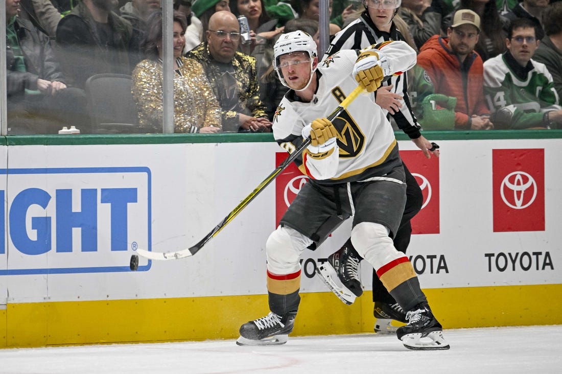 Nov 22, 2023; Dallas, Texas, USA; Vegas Golden Knights center Jack Eichel (9) passes the puck against the Dallas Stars during the third period at the American Airlines Center. Mandatory Credit: Jerome Miron-USA TODAY Sports