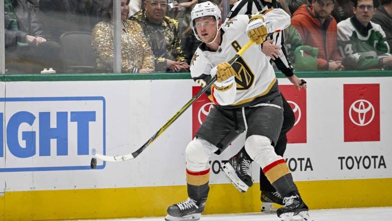 Nov 22, 2023; Dallas, Texas, USA; Vegas Golden Knights center Jack Eichel (9) passes the puck against the Dallas Stars during the third period at the American Airlines Center. Mandatory Credit: Jerome Miron-USA TODAY Sports