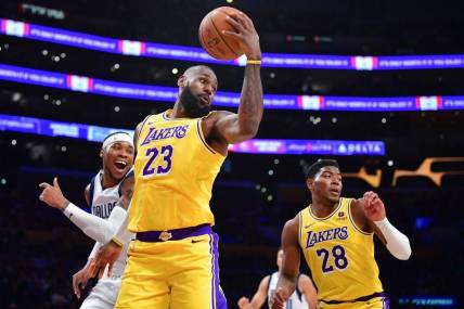 Nov 22, 2023; Los Angeles, California, USA; Los Angeles Lakers forward LeBron James (23) gets the rebound against the Dallas Mavericks during the first half at Crypto.com Arena. Mandatory Credit: Gary A. Vasquez-USA TODAY Sports