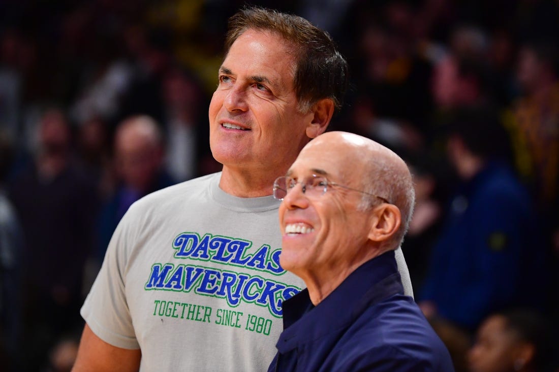 Nov 22, 2023; Los Angeles, California, USA; Dallas Mavericks owner Mark Cuban meets with media executive Jeffrey Katzenberg at Crypto.com Arena. Mandatory Credit: Gary A. Vasquez-USA TODAY Sports