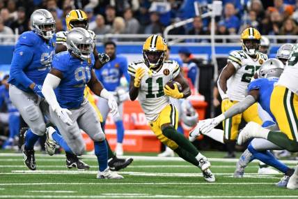 Nov 23, 2023; Detroit, Michigan, USA; Green Bay Packers wide receiver Jayden Reed (11) runs the ball against the Detroit Lions in the first quarter at Ford Field. Mandatory Credit: Lon Horwedel-USA TODAY Sports