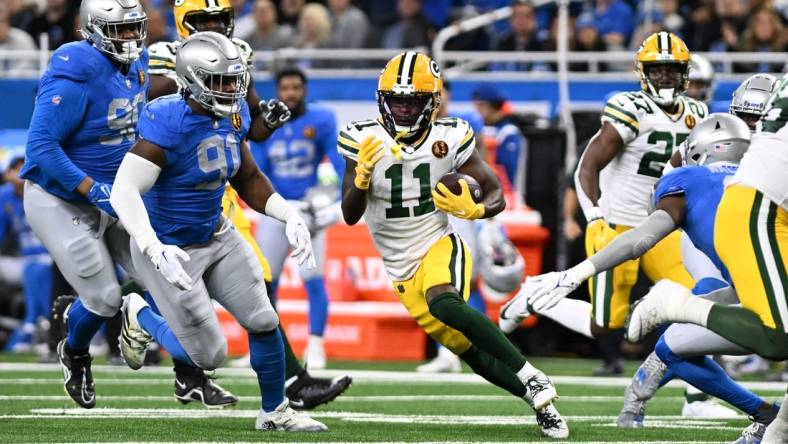 Nov 23, 2023; Detroit, Michigan, USA; Green Bay Packers wide receiver Jayden Reed (11) runs the ball against the Detroit Lions in the first quarter at Ford Field. Mandatory Credit: Lon Horwedel-USA TODAY Sports