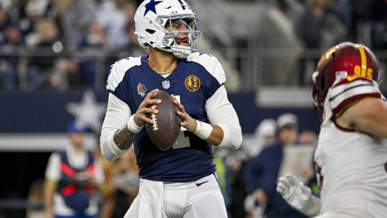 Nov 23, 2023; Arlington, Texas, USA; Dallas Cowboys quarterback Dak Prescott (4) drops back to pass against the Washington Commanders during the second quarter at AT&T Stadium. Mandatory Credit: Jerome Miron-USA TODAY Sports