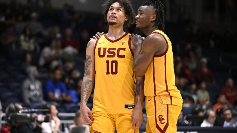 Nov 23, 2023; La Jolla, California, USA; USC Trojans forward DJ Rodman (10) and guard Isaiah Collier (1) embrace during the second half against the Seton Hall Pirates at LionTree Arena. Mandatory Credit: Orlando Ramirez-USA TODAY Sports