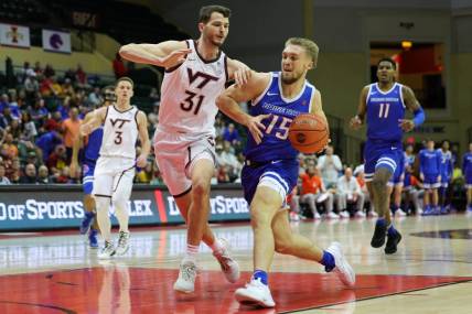 Nov 23, 2023; Kissimmee, FL, USA;  Boise State Broncos guard Jace Whiting (15) drives to the basket past Virginia Tech Hokies forward Robbie Beran (31) in the first half during the ESPN Events Invitational at State Farm Field House. Mandatory Credit: Nathan Ray Seebeck-USA TODAY Sports