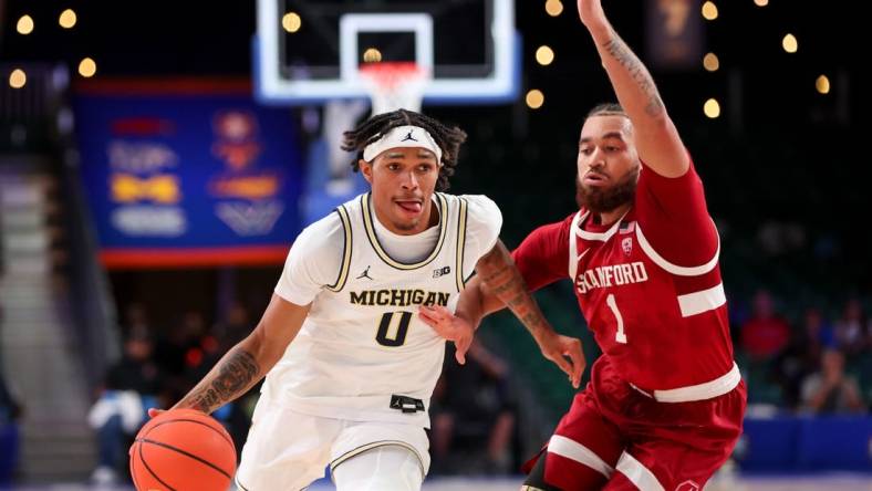 Nov 23, 2023; Paradise Island, BAHAMAS;  Michigan Wolverines guard Dug McDaniel (0) drives to the basket as Stanford Cardinal guard Jared Bynum (1) defends during the first half at Imperial Arena. Mandatory Credit: Kevin Jairaj-USA TODAY Sports