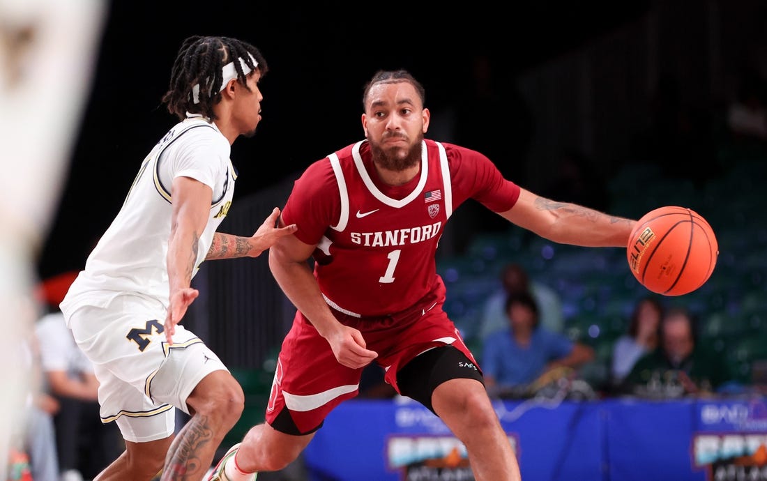 Nov 23, 2023; Paradise Island, BAHAMAS;  Stanford Cardinal guard Jared Bynum (1) drives to the basket as Michigan Wolverines guard Dug McDaniel (0) defends during the second half at Imperial Arena. Mandatory Credit: Kevin Jairaj-USA TODAY Sports