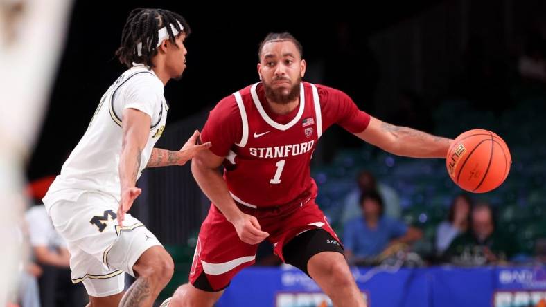 Nov 23, 2023; Paradise Island, BAHAMAS;  Stanford Cardinal guard Jared Bynum (1) drives to the basket as Michigan Wolverines guard Dug McDaniel (0) defends during the second half at Imperial Arena. Mandatory Credit: Kevin Jairaj-USA TODAY Sports