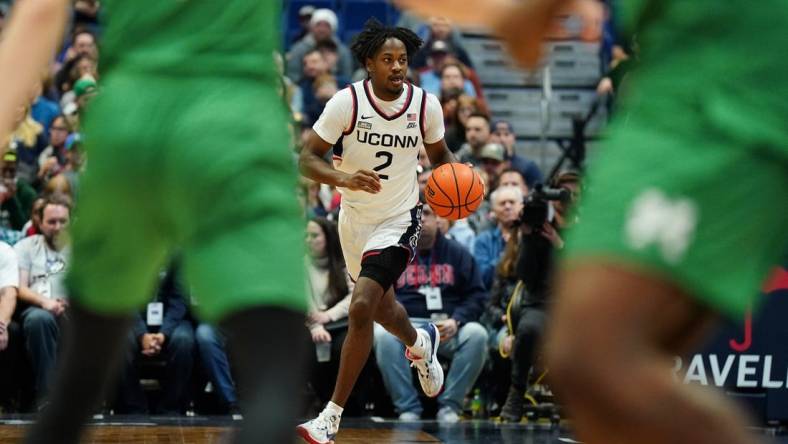 Nov 24, 2023; Hartford, Connecticut, USA; UConn Huskies guard Tristen Newton (2) returns the ball again st the Manhattan Jaspers in the first half at XL Center. Mandatory Credit: David Butler II-USA TODAY Sports