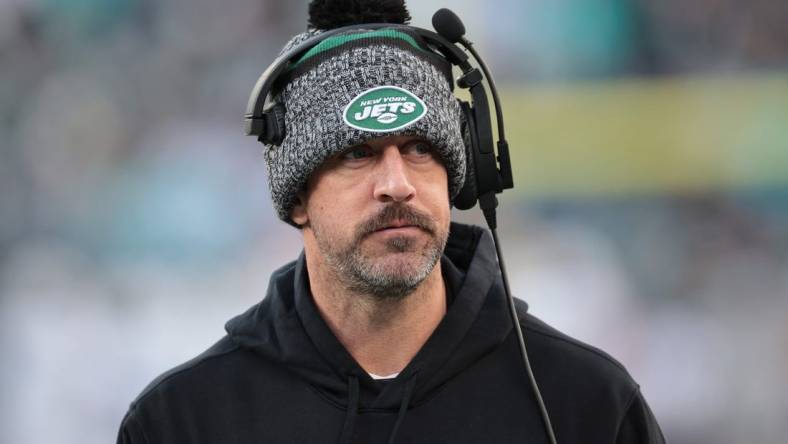 Nov 24, 2023; East Rutherford, New Jersey, USA; New York Jets quarterback Aaron Rodgers (8) on the sidelines during the first half against the Miami Dolphins at MetLife Stadium. Mandatory Credit: Vincent Carchietta-USA TODAY Sports