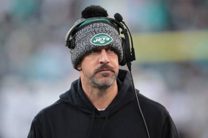 Nov 24, 2023; East Rutherford, New Jersey, USA; New York Jets quarterback Aaron Rodgers (8) on the sidelines during the first half against the Miami Dolphins at MetLife Stadium. Mandatory Credit: Vincent Carchietta-USA TODAY Sports