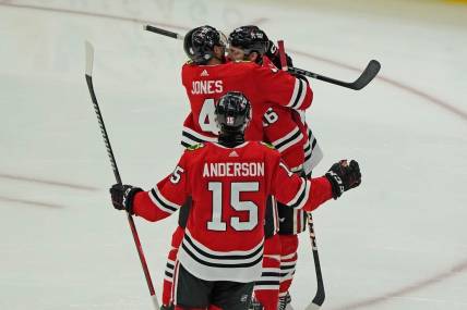 Nov 24, 2023; Chicago, Illinois, USA; Chicago Blackhawks center Jason Dickinson (16) celebrates his hat trick against the Toronto Maple Leafs during the third period at United Center. Mandatory Credit: David Banks-USA TODAY Sports