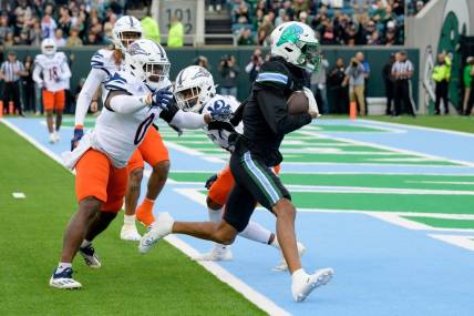 Nov 24, 2023; New Orleans, Louisiana, USA; Tulane Green Wave wide receiver Chris Brazzell II (17) runs around UTSA Roadrunners defensive back Ken Robinson (21) for a touchdown during the first half at Yulman Stadium. Mandatory Credit: Matthew Hinton-USA TODAY Sports