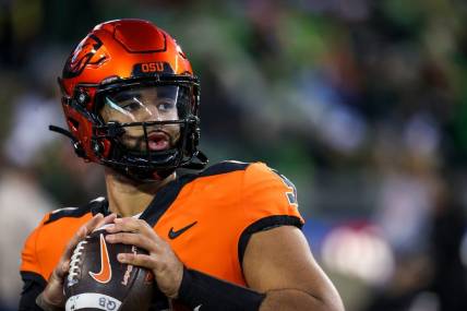 Oregon State Beavers quarterback DJ Uiagalelei warm ups before the annual rivalry game against Oregon on Friday, Nov. 24, 2023 at Autzen Stadium in Eugene, Ore.