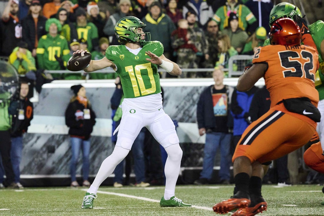 Nov 24, 2023; Eugene, Oregon, USA; Oregon Ducks quarterback Bo Nix (10) throws a pass during the first half against the Oregon State Beavers at Autzen Stadium. Mandatory Credit: Troy Wayrynen-USA TODAY Sports