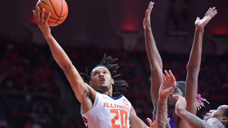 Nov 24, 2023; Champaign, Illinois, USA;  Illinois Fighting Illini forward Ty Rodgers (20) drives to the basket during the first half against the Western Illinois Leathernecks at State Farm Center. Mandatory Credit: Ron Johnson-USA TODAY Sports