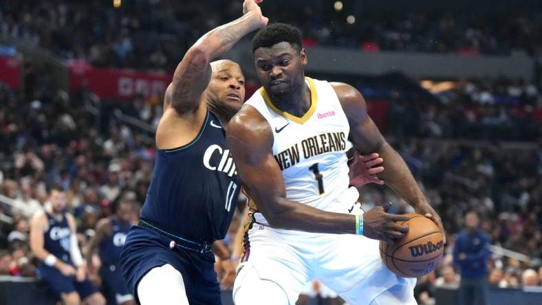 Nov 24, 2023; Los Angeles, California, USA; New Orleans Pelicans forward Zion Williamson (1) moves to the basket against LA Clippers forward P.J. Tucker (17) in the first half at Crypto.com Arena. Mandatory Credit: Kirby Lee-USA TODAY Sports