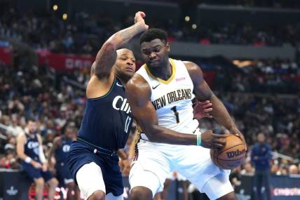 Nov 24, 2023; Los Angeles, California, USA; New Orleans Pelicans forward Zion Williamson (1) moves to the basket against LA Clippers forward P.J. Tucker (17) in the first half at Crypto.com Arena. Mandatory Credit: Kirby Lee-USA TODAY Sports