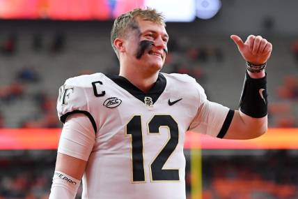 Nov 25, 2023; Syracuse, New York, USA; Wake Forest Demon Deacons quarterback Mitch Griffis (12) gestures to fans prior to the game against the Syracuse Orange at the JMA Wireless Dome. Mandatory Credit: Rich Barnes-USA TODAY Sports