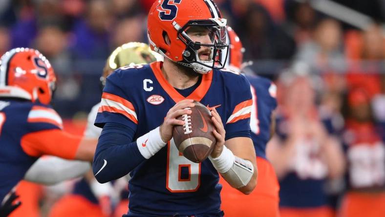 Nov 25, 2023; Syracuse, New York, USA; Syracuse Orange quarterback Garrett Schrader (6) drops back to pass against the Wake Forest Demon Deacons during the first half at the JMA Wireless Dome. Mandatory Credit: Rich Barnes-USA TODAY Sports