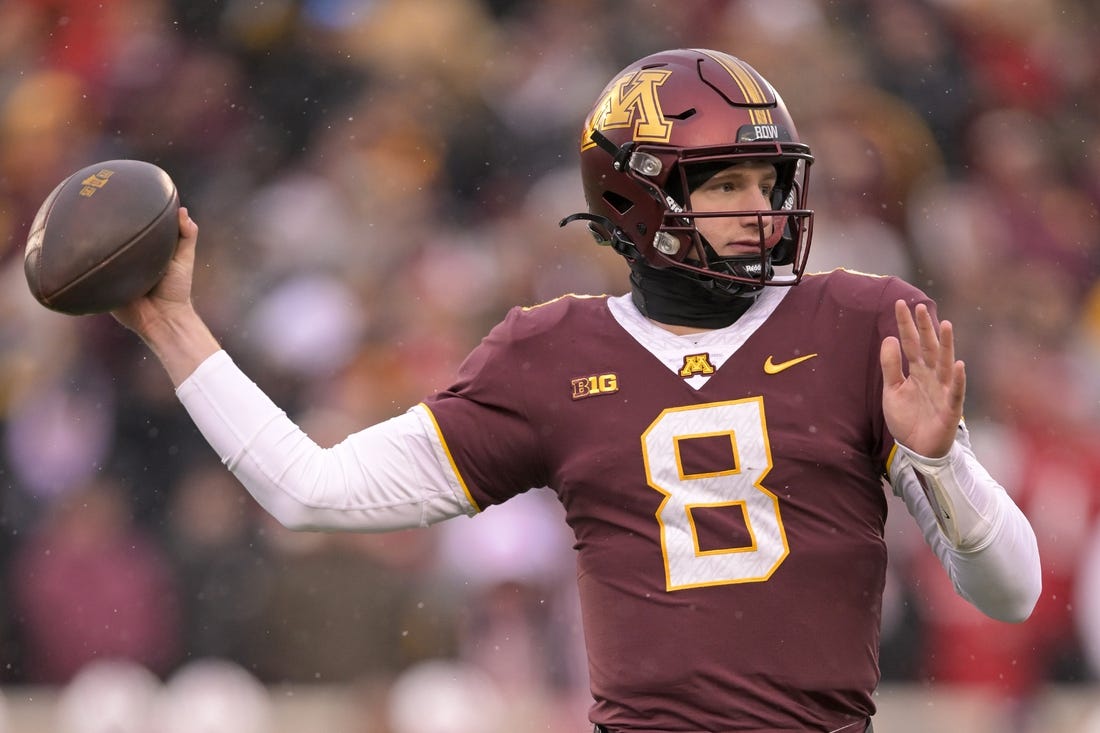 Nov 25, 2023; Minneapolis, Minnesota, USA;  Minnesota Golden Gophers quarterback Athan Kaliakmanis (8) makes a throw against the Wisconsin Badgers during the second quarter at Huntington Bank Stadium. Mandatory Credit: Nick Wosika-USA TODAY Sports