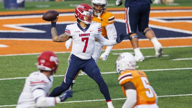 Nov 25, 2023; El Paso, Texas, USA; No. 22 Liberty Flames quarterback Kaidon Salter (7) tries throws the ball against the UTEP Miners defense during the first half at Sun Bowl Stadium. Mandatory Credit: Ivan Pierre Aguirre-USA TODAY Sports