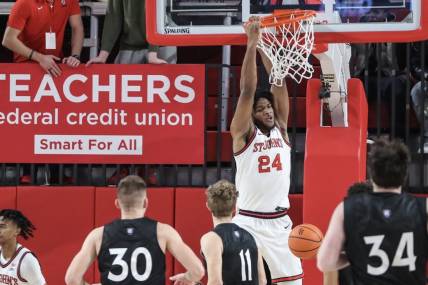 Nov 25, 2023; Queens, New York, USA; St. John's Red Storm forward Zuby Ejiofor (24) dunks in the first half against the Holy Cross Crusaders at Carnesecca Arena. Mandatory Credit: Wendell Cruz-USA TODAY Sports