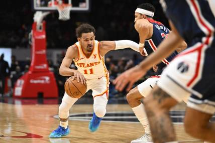 Nov 25, 2023; Washington, District of Columbia, USA; Atlanta Hawks guard Trae Young (11) dribbles against the Washington Wizards during the first half at Capital One Arena. Mandatory Credit: Brad Mills-USA TODAY Sports