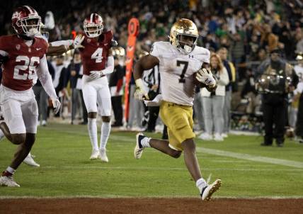 Nov 25, 2023; Stanford, California, USA; Notre Dame Fighting Irish running back Audric Estim   (7) breaks free for another touchdown run against the Stanford Cardinal during the third quarter at Stanford Stadium. Mandatory Credit: D. Ross Cameron-USA TODAY Sports