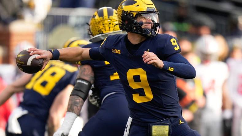 Nov 25, 2023; Ann Arbor, Michigan, USA; Michigan Wolverines quarterback J.J. McCarthy (9) throws during the second half of the NCAA football game against the Ohio State Buckeyes at Michigan Stadium. Ohio State lost 30-24.