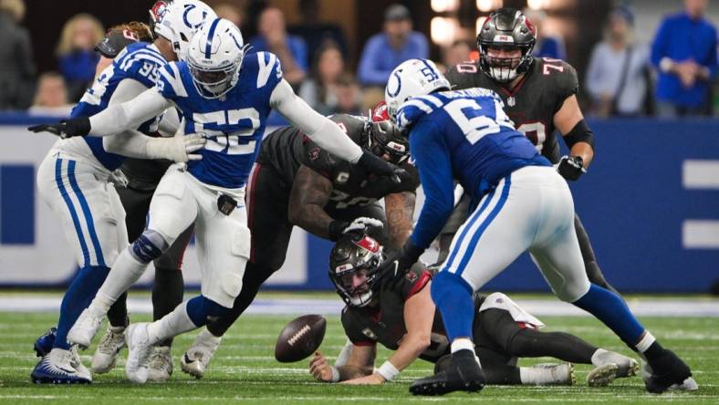 Nov 26, 2023; Indianapolis, Indiana, USA; Tampa Bay Buccaneers quarterback Baker Mayfield (6) is sacked and fumbles the ball toward the end of the second half against the Indianapolis Colts at Lucas Oil Stadium. Mandatory Credit: Marc Lebryk-USA TODAY Sports