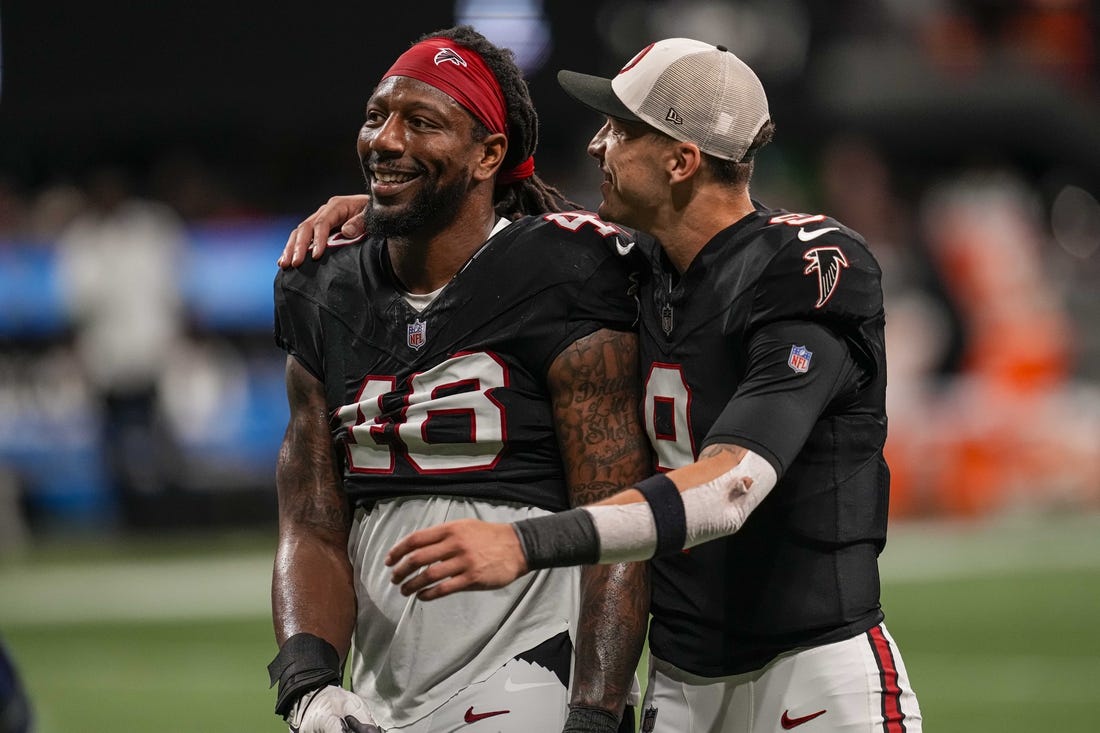 Nov 26, 2023; Atlanta, Georgia, USA; Atlanta Falcons linebacker Bud Dupree (48) and quarterback Desmond Ridder (9) react after defeating the New Orleans Saints at Mercedes-Benz Stadium. Mandatory Credit: Dale Zanine-USA TODAY Sports