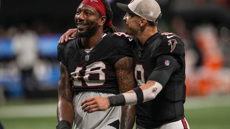 Nov 26, 2023; Atlanta, Georgia, USA; Atlanta Falcons linebacker Bud Dupree (48) and quarterback Desmond Ridder (9) react after defeating the New Orleans Saints at Mercedes-Benz Stadium. Mandatory Credit: Dale Zanine-USA TODAY Sports