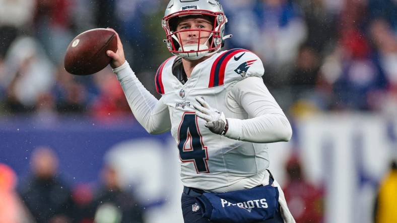 Nov 26, 2023; East Rutherford, New Jersey, USA; New England Patriots quarterback Bailey Zappe (4) throws the ball during the second half against the New York Giants at MetLife Stadium. Mandatory Credit: Vincent Carchietta-USA TODAY Sports