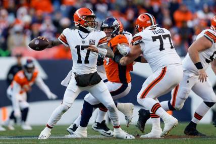 Nov 26, 2023; Denver, Colorado, USA; Cleveland Browns quarterback Dorian Thompson-Robinson (17) looks to pass as guard Wyatt Teller (77) defends against Denver Broncos defensive end Zach Allen (99) in the second quarter at Empower Field at Mile High. Mandatory Credit: Isaiah J. Downing-USA TODAY Sports