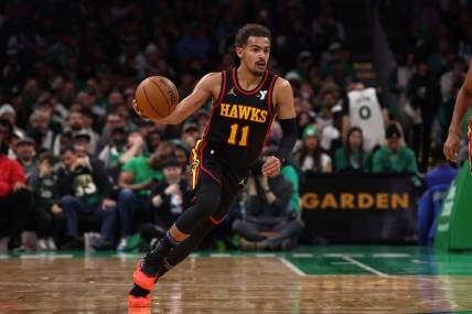 Nov 26, 2023; Boston, Massachusetts, USA; Atlanta Hawks guard Trae Young (11) brings the ball up the court against the Boston Celtics during the second quarter at TD Garden. Mandatory Credit: Winslow Townson-USA TODAY Sports
