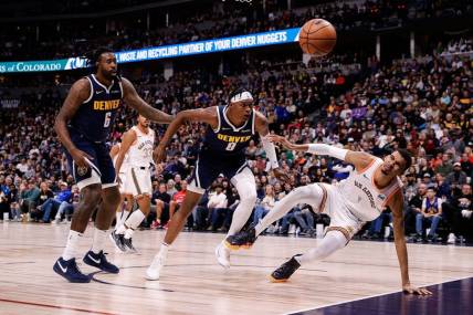 Nov 26, 2023; Denver, Colorado, USA; Denver Nuggets center DeAndre Jordan (6) and forward Peyton Watson (8) and San Antonio Spurs center Victor Wembanyama (1) watch for a loose ball in the second quarter at Ball Arena. Mandatory Credit: Isaiah J. Downing-USA TODAY Sports