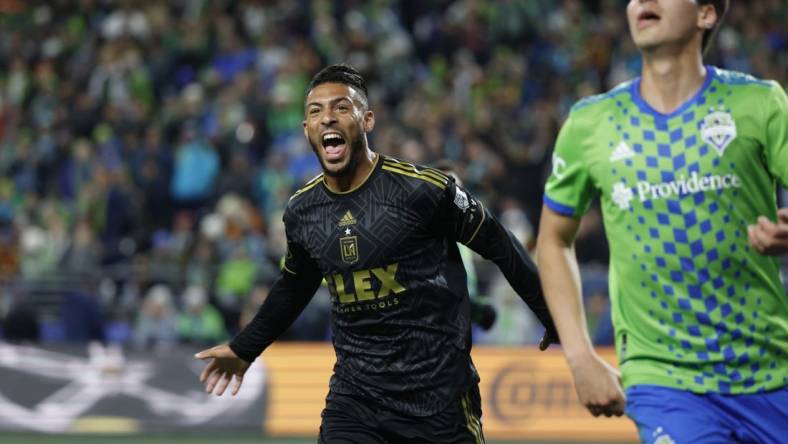 Nov 26, 2023; Seattle, Washington, USA; Los Angeles FC forward Denis Bouanga (99) reacts after scoring during the first half of a MLS Cup Western Conference Semifinal match against the Seattle Sounders at Lumen Field. Mandatory Credit: Joe Nicholson-USA TODAY Sports