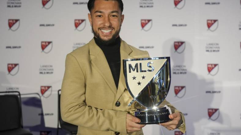 Nov 27, 2023; Cincinnati, OH, USA;  FC Cincinnati   s Luciano Acosta poses for a photo with the Landon Donovan MLS MVP award during a press conference at TQL Stadium. Mandatory Credit: Aaron Doster-USA TODAY Sports