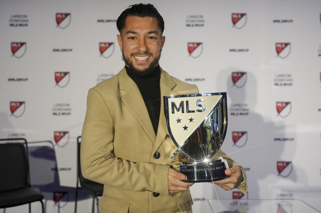 Nov 27, 2023; Cincinnati, OH, USA;  FC Cincinnati   s Luciano Acosta poses for a photo with the Landon Donovan MLS MVP award during a press conference at TQL Stadium. Mandatory Credit: Aaron Doster-USA TODAY Sports