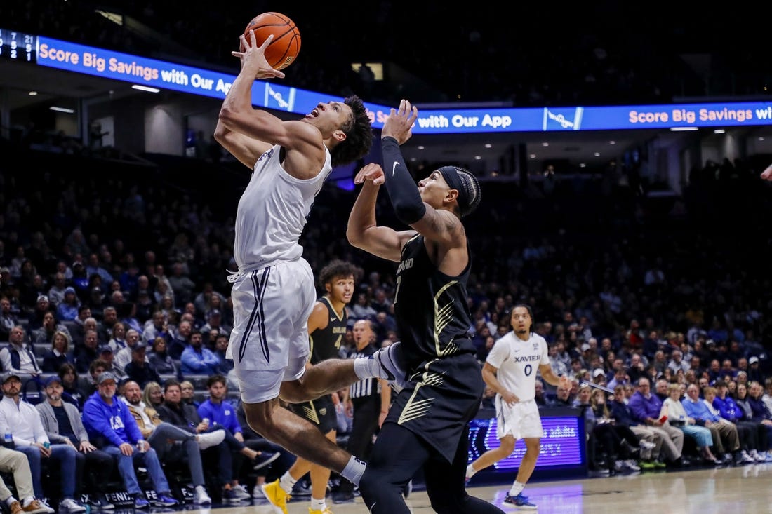 Nov 27, 2023; Cincinnati, Ohio, USA; Xavier Musketeers guard Desmond Claude (1) shoots against Oakland Golden Grizzlies guard Isaiah Jones (7) in the first half at Cintas Center. Mandatory Credit: Katie Stratman-USA TODAY Sports