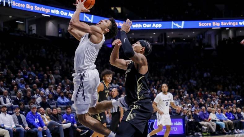 Nov 27, 2023; Cincinnati, Ohio, USA; Xavier Musketeers guard Desmond Claude (1) shoots against Oakland Golden Grizzlies guard Isaiah Jones (7) in the first half at Cintas Center. Mandatory Credit: Katie Stratman-USA TODAY Sports