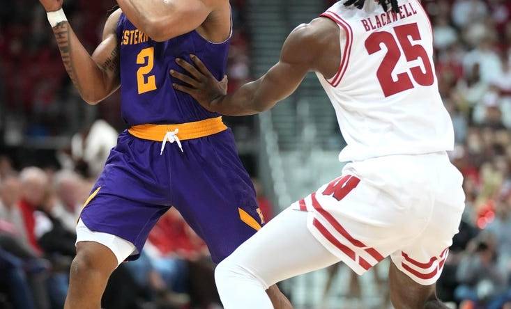 Nov 27, 2023; Madison, Wisconsin, USA;  Western Illinois Leathernecks guard Ryan Myers (2) looks to pass the ball while defended by Wisconsin Badgers guard John Blackwell (25) during the first half at the Kohl Center. Mandatory Credit: Kayla Wolf-USA TODAY Sports