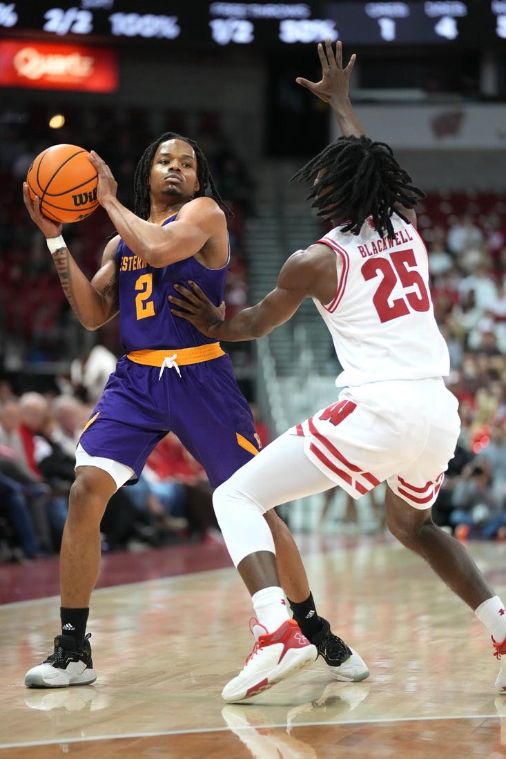 Nov 27, 2023; Madison, Wisconsin, USA;  Western Illinois Leathernecks guard Ryan Myers (2) looks to pass the ball while defended by Wisconsin Badgers guard John Blackwell (25) during the first half at the Kohl Center. Mandatory Credit: Kayla Wolf-USA TODAY Sports