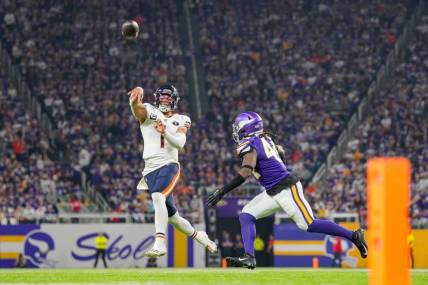 Nov 27, 2023; Minneapolis, Minnesota, USA; Chicago Bears quarterback Justin Fields (1) passes against the Minnesota Vikings in the second quarter at U.S. Bank Stadium. Mandatory Credit: Brad Rempel-USA TODAY Sports