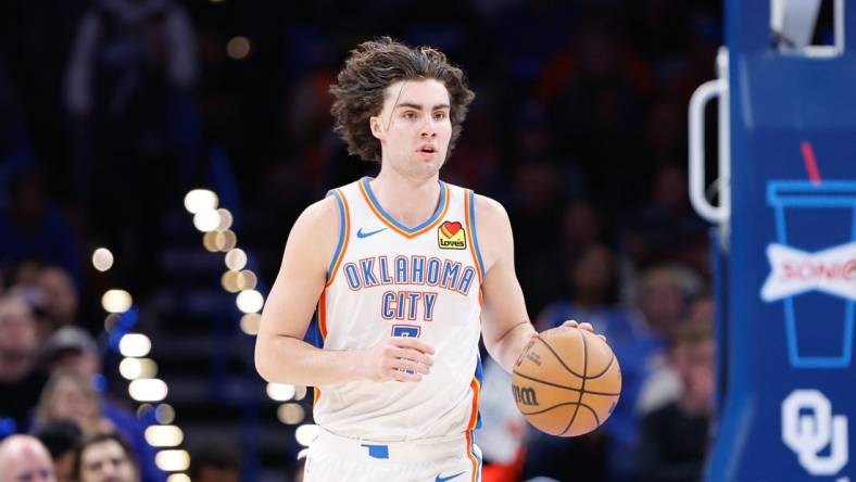 Nov 25, 2023; Oklahoma City, Oklahoma, USA; Oklahoma City Thunder guard Josh Giddey (3) dribbles the ball up the court against the Philadelphia 76ers during the second half at Paycom Center. Mandatory Credit: Alonzo Adams-USA TODAY Sports